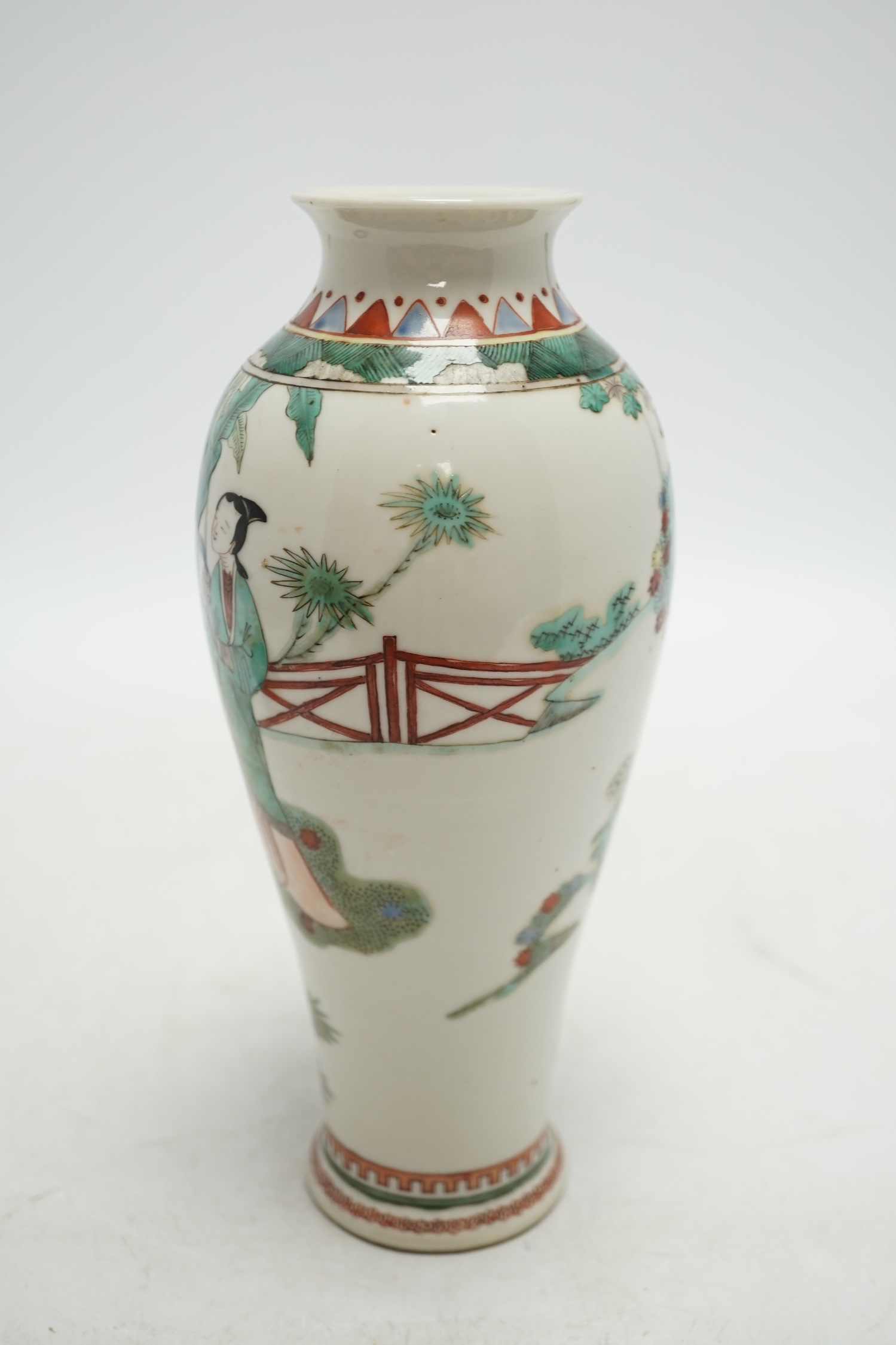 A 19th century Chinese porcelain famille verte vase and associated hardwood stand, 23cm high. Condition - good